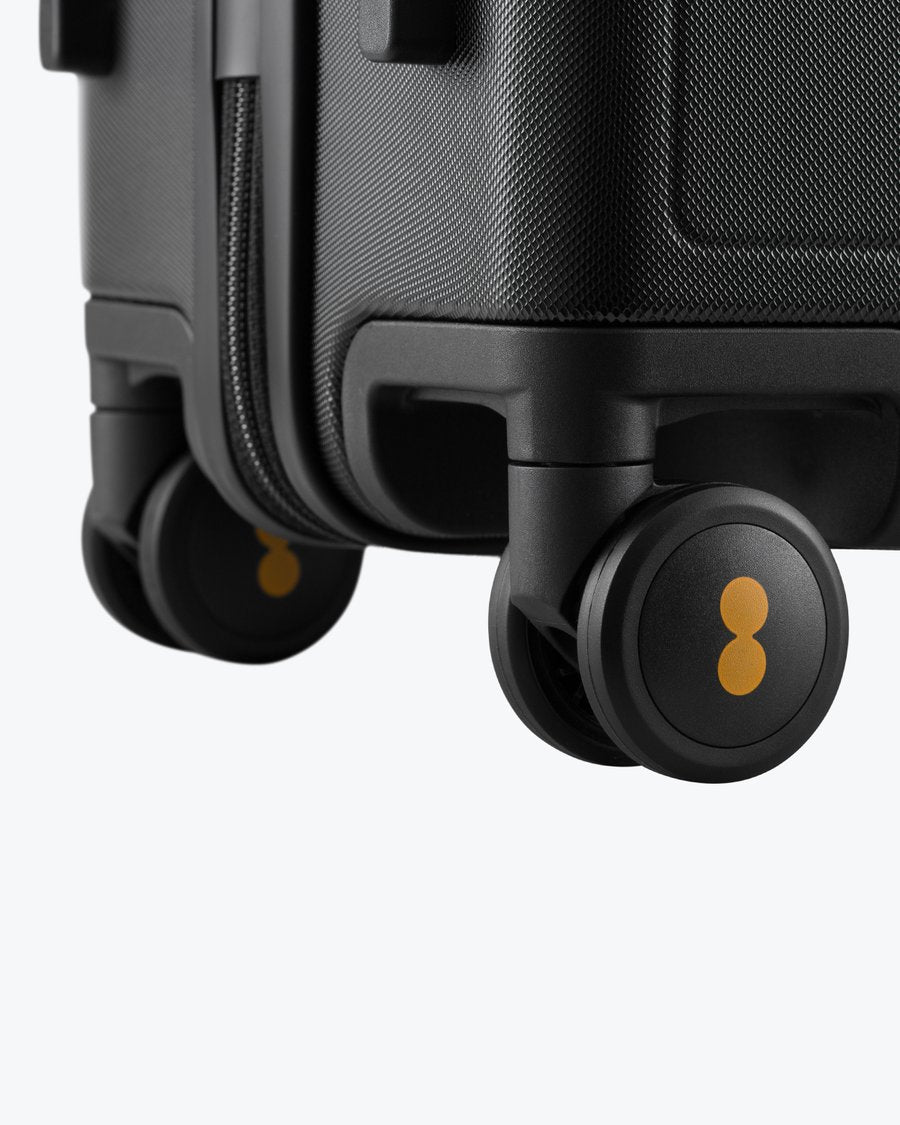 Luminous Textured Carry-On 20'' Black-Spinner Wheels Detail